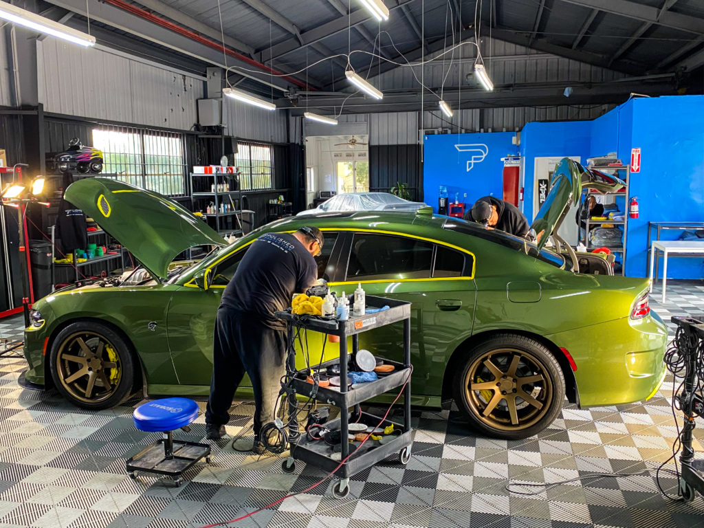 This Dodge charger is being paint corrected for maximum glossy paint with no swirl marks